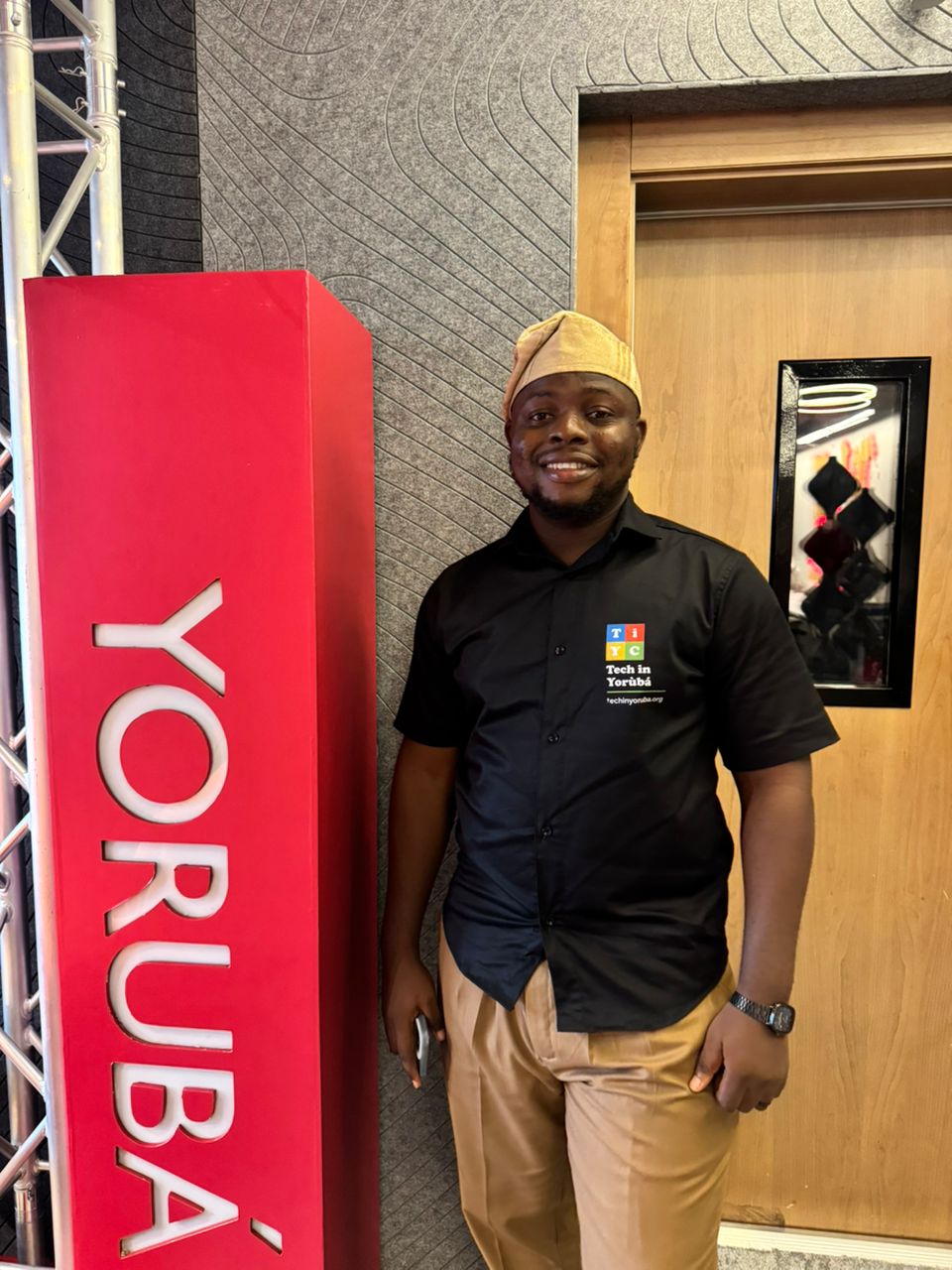 Theophilus Adegbohungbe putting on Tech in Yoruba official outfit at the BBC Studio in Lagos, Nigeria